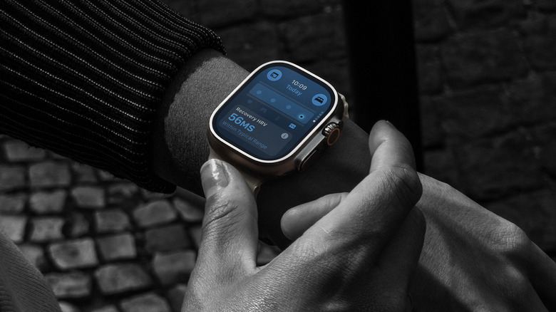 A black and white image of an Apple Watch Ultra 4 on a wrist showing recovery heart rate data.