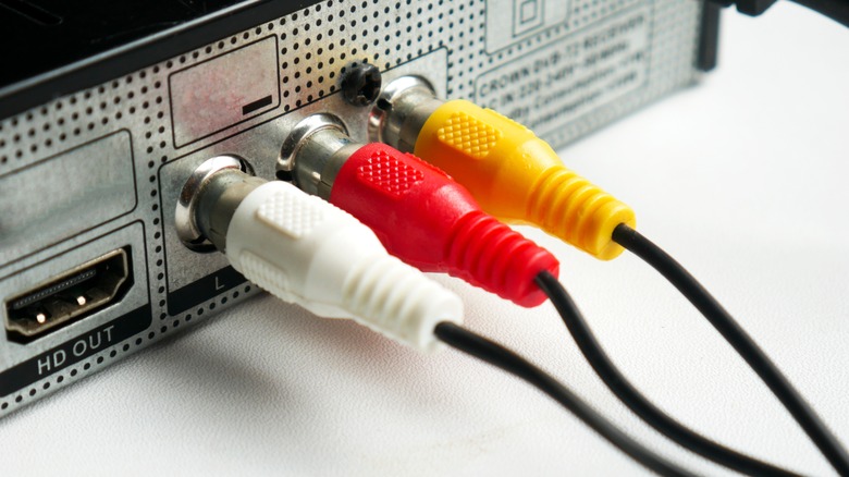 Close-up photograph of AV ports plugged into a cable box.