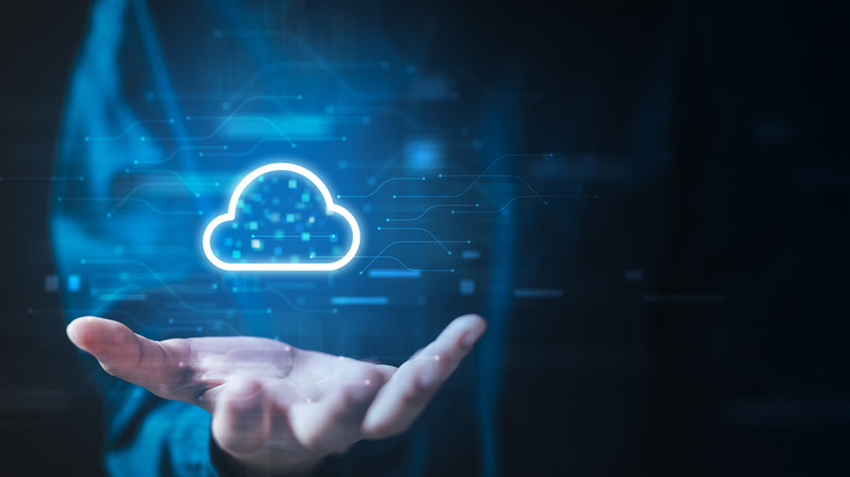 Cloud icon hovering above hand