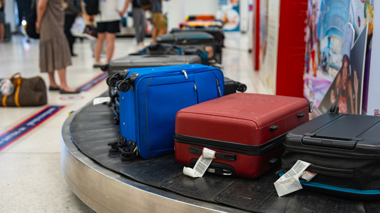 suitcases on the luggage belt at an airport