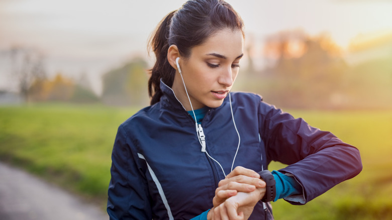 Woman using a smartwatch during a run