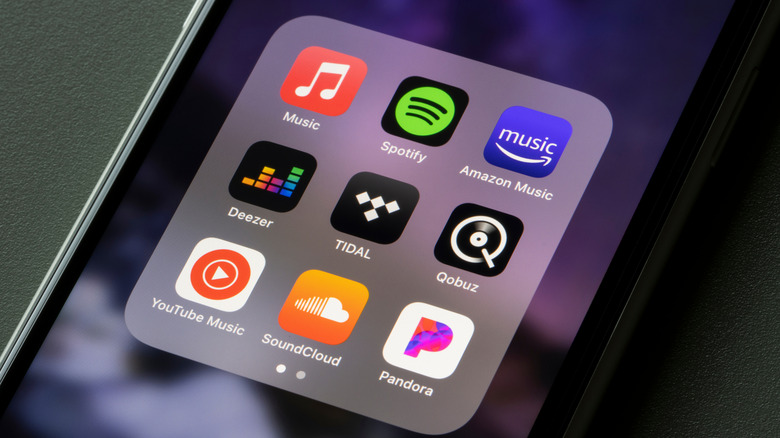 A variety of music streaming apps on a phone.
