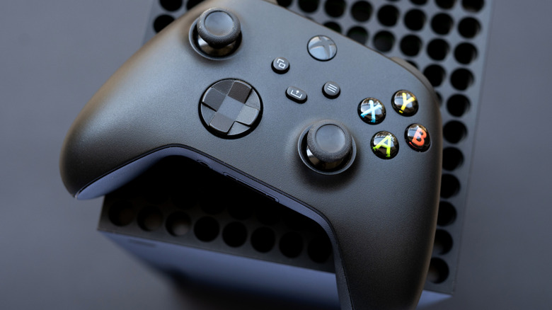 Xbox Series X console with a controller on top.