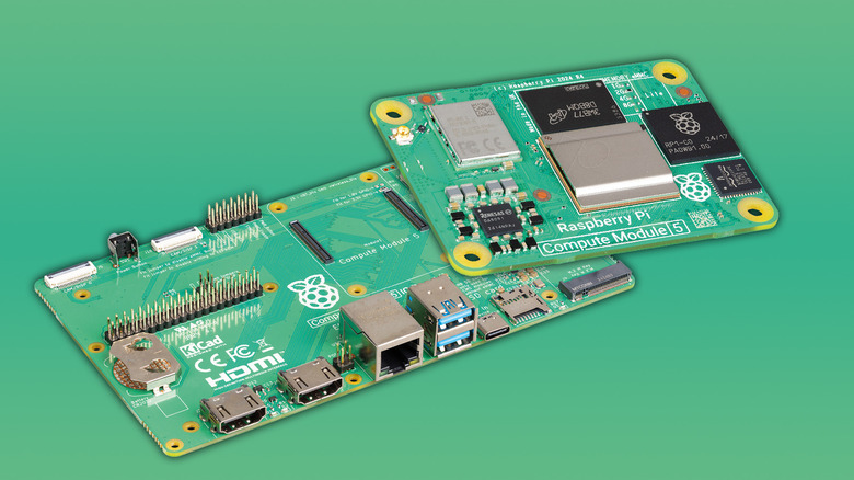 A Raspberry Pi 5 Compute Module 5 and and a carrier board against a solid light green background.