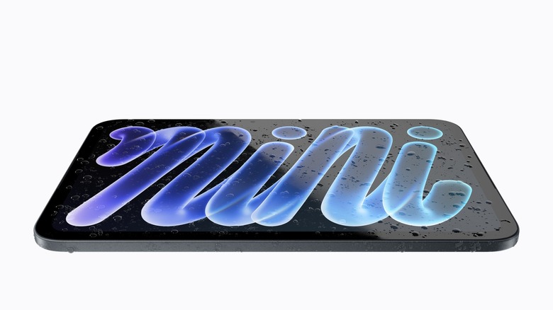 new Apple iPad Mini on white background with water droplets on display