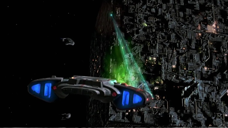 A closeup of a Borg cube from Star Trek First Contact targeting a Federation ship.