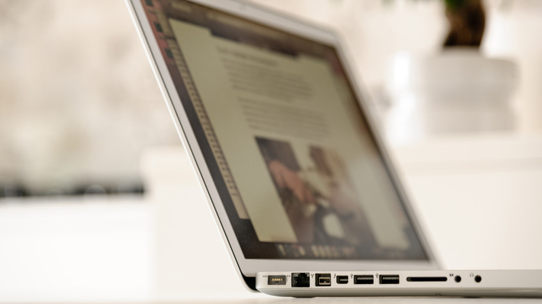 A narrow focus shot of a 2012 MacBook Pro, showing all the ports