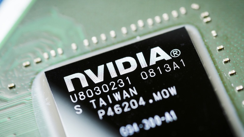 An exposed Nvidia GPU die on a circuit board with the Nvidia logo on it and part numbers.