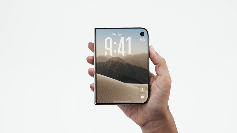 Hand holding the new iPhone Duo.