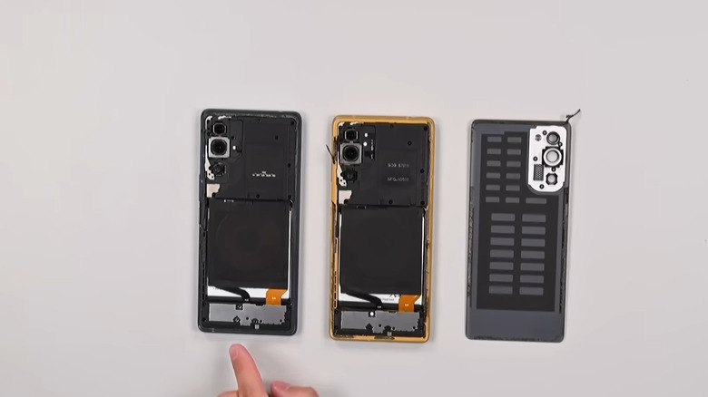 Trump T1 phone disassembled next to a HTC device.