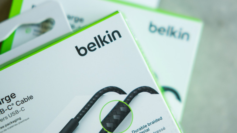 Close-up of a box of a Belkin charging cable with another blurred box in the background