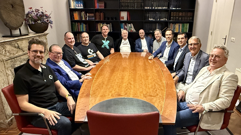 Members of Commodore sat around a table
