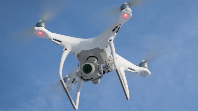 A DJI Phantom drone flying in the air.