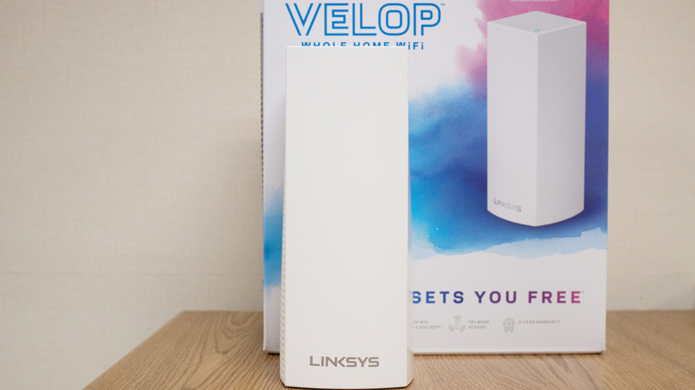 Linksys Velop Mesh Wi-Fi system on a wooden table