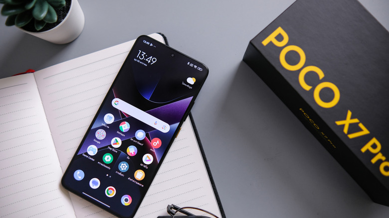 POCO phone next to its box.