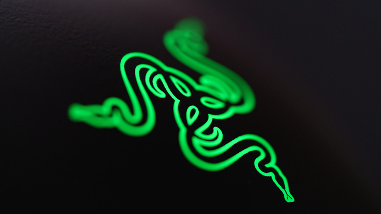 Glowing Razer logo on a black backdrop