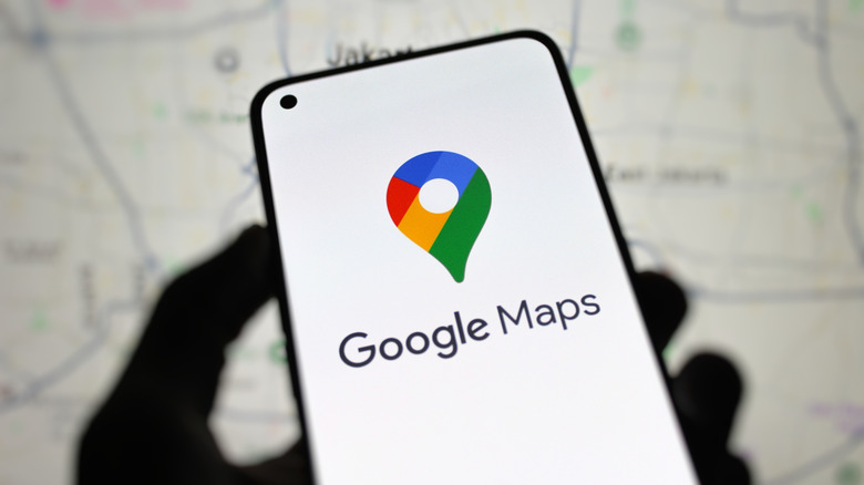 The Google Maps logo on a smartphone display.