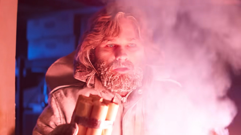 Mac from The Thing (1982) holding dynamite with an intense expression