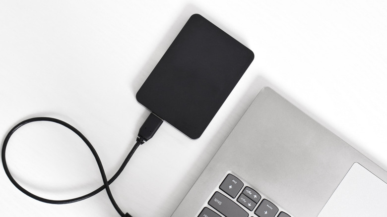 An external hard drive connected to a laptop