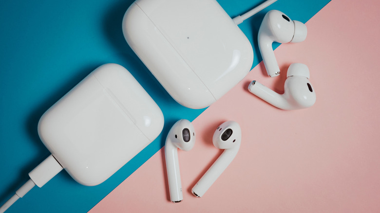 The AirPods Pro and standard AirPods with charging cases, placed next to each other.