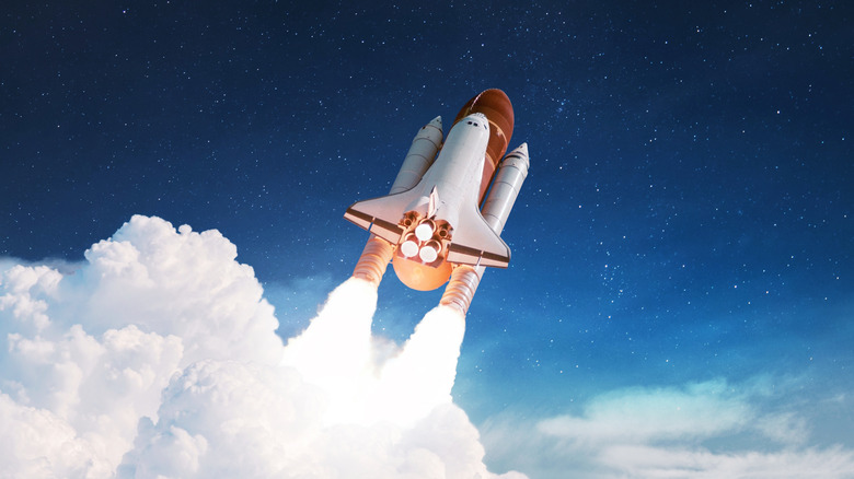 Artistic rendition of space shuttle launching into the atmosphere