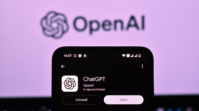 ChatGPT app on a phone with the OpenAI logo in the background