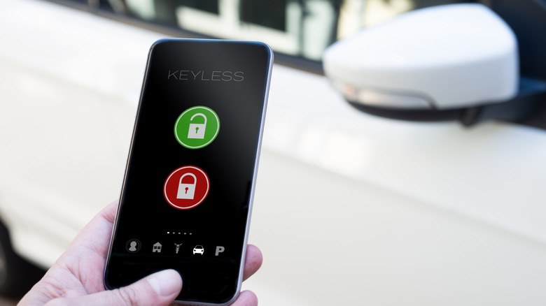 a person accessing their car via a digital key on their smartphone