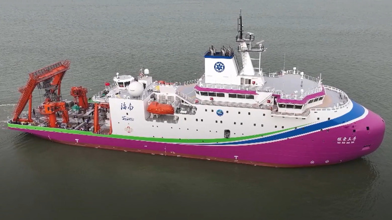A white and pink deep sea research vessel leaves the port of Guangzhou City in south China.