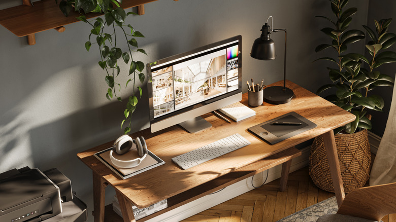 A home office with a modest-sized desktop monitor