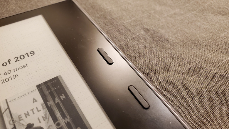 A close-up of the physical buttons on the Kindle Oasis reader.