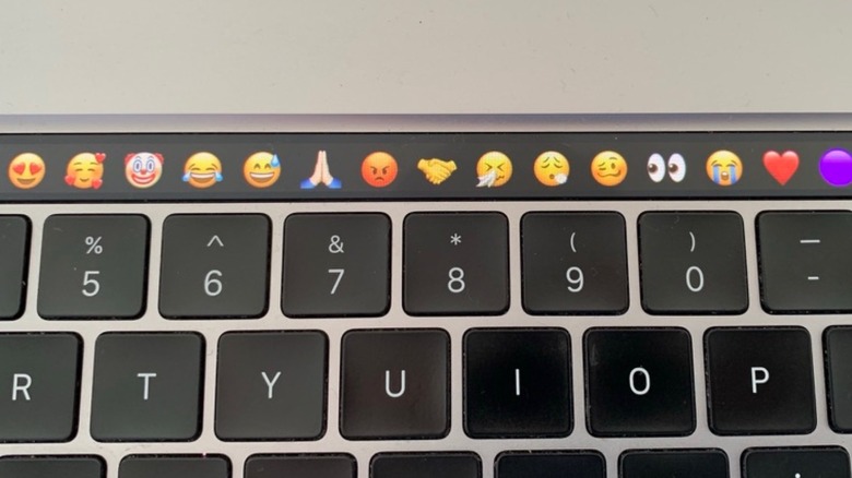 MacBook Pro's Touch Bar displaying most used emojis