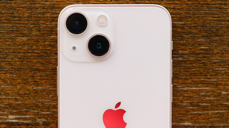 The back side of an iPhone 13 Mini in Pink.