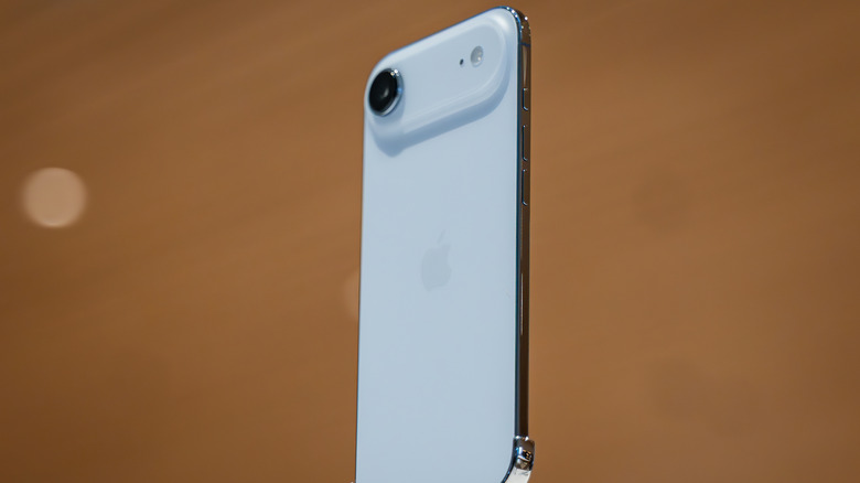 The ultra-thin iPhone Air on display with the titanium frame in view.