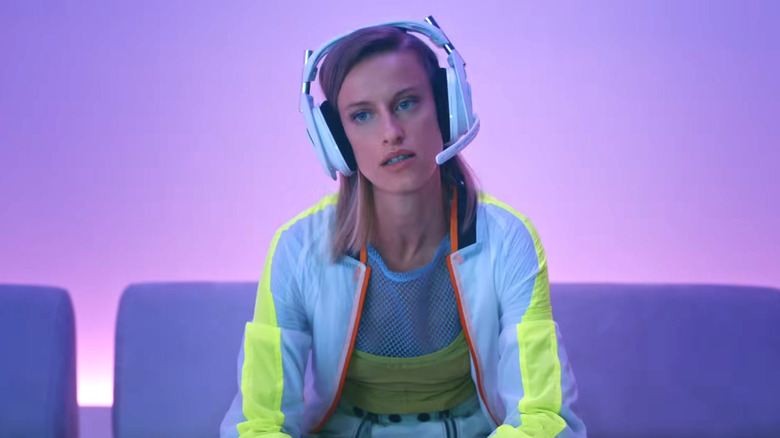 A young person wearing an Astro Gaming A50 X headset.