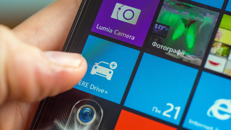 Extreme close up of a hand using a Lumia 640 phone