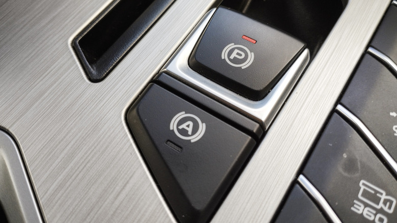 An EPB switch in a car's center console.