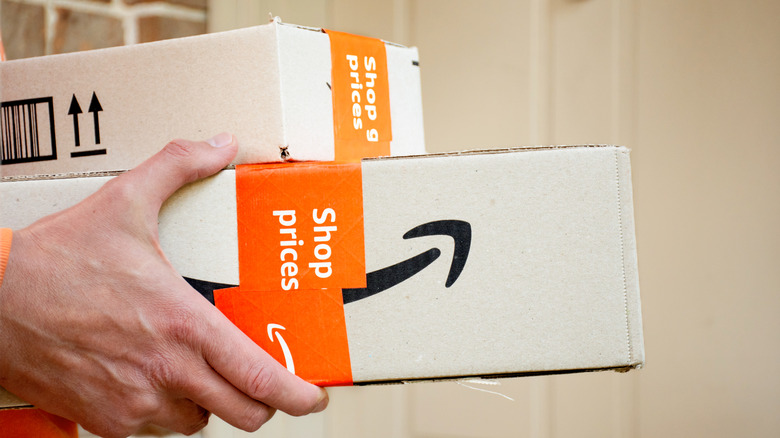 Person delivering Amazon boxes