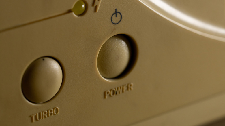 Closeup of a PC case with a turbo button and power button