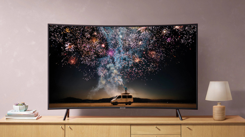 A Samsung TV with a curved screen