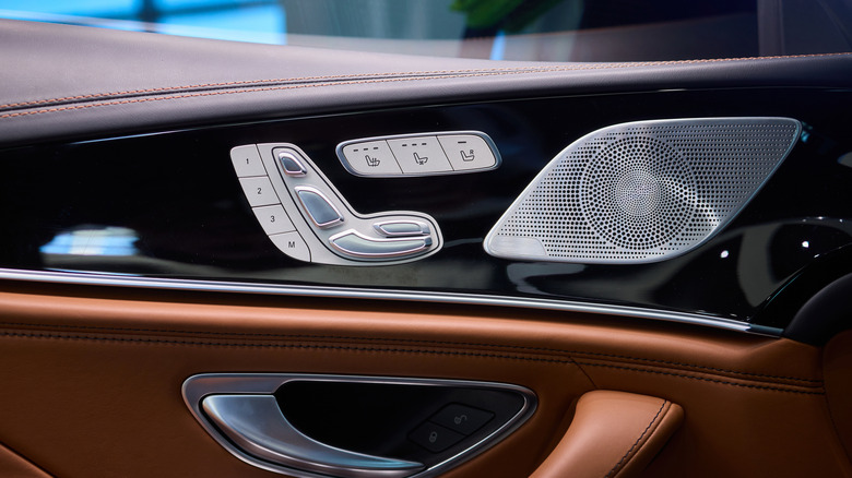 A car's interior with a speaker in view