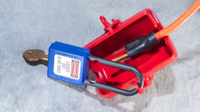 An electrical plug in a lockout device.