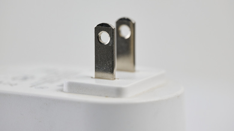 Metal prongs on a type-A electrical plug.