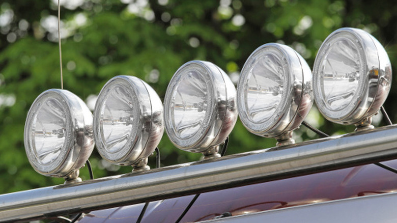 White off-road lights mounted on a roll bar