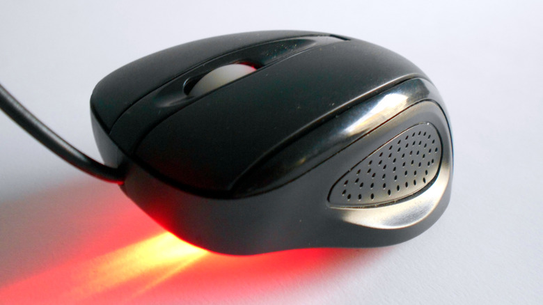 Optical mouse laser glowing red.