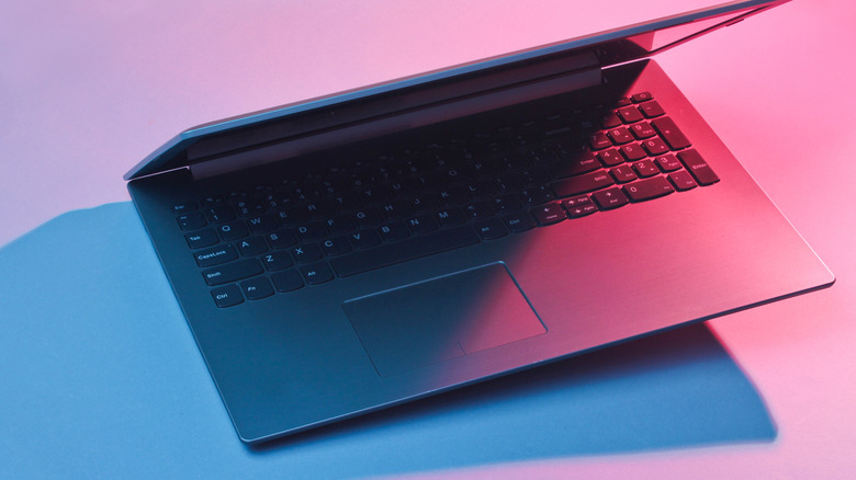 A Lenovo laptop with the touchpad to the left.