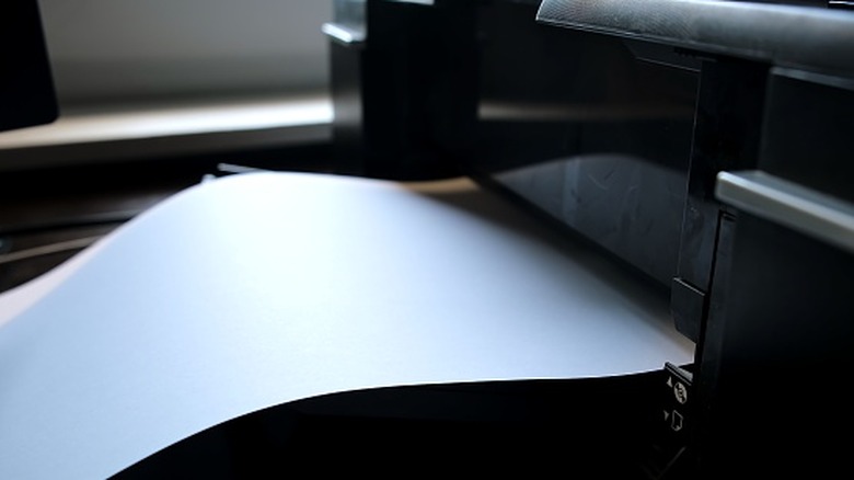 A sheet coming out of a color printer.