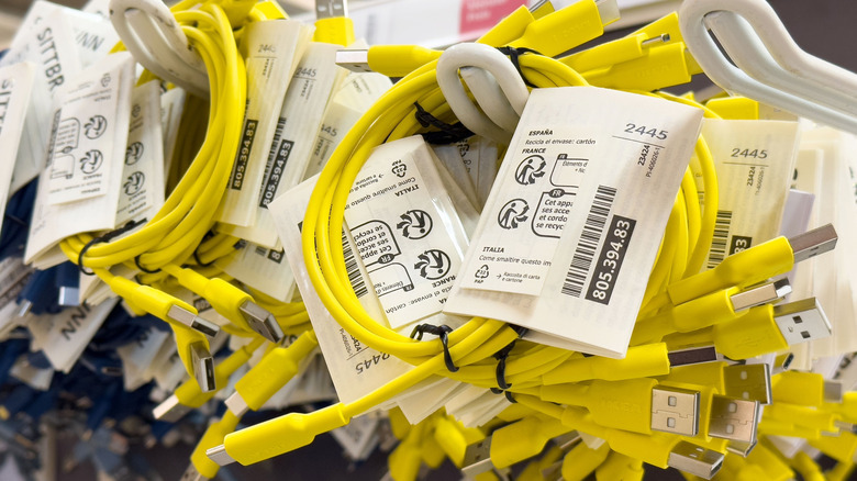 A batch of USB cables with attached labels at a store