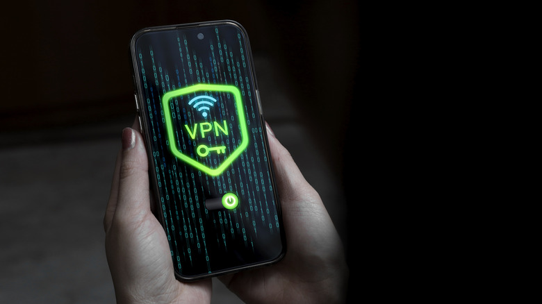 A person activating a virtual private network on a smartphone with icons visible.