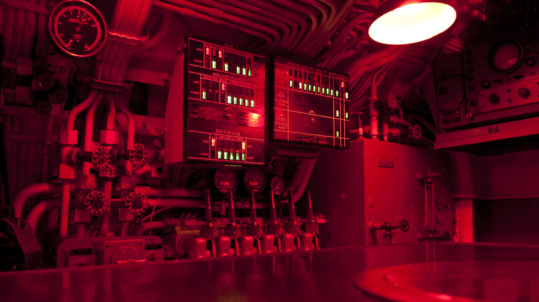 The interior of a submarine in red light