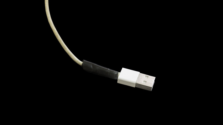 A USB cable that has been wrapped with electrical tape